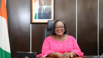 Stylish African American black businessman talks on his smartpho